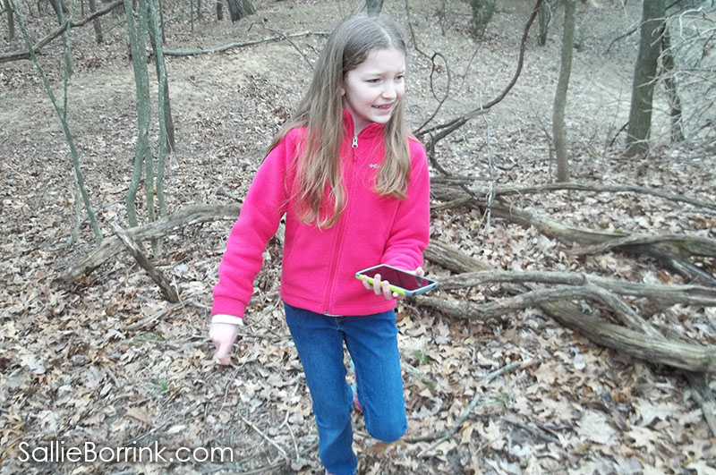 geocaching hunting in woods