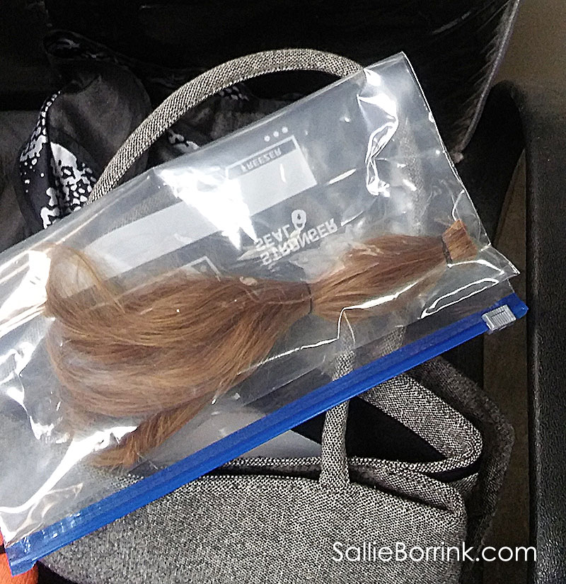 Putting Hair Donation Ponytail in a Clean Bag