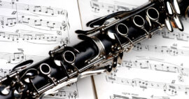 Clarinet laying on piece of sheet music