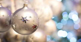 White Christmas bulb with silver starts and blue lights