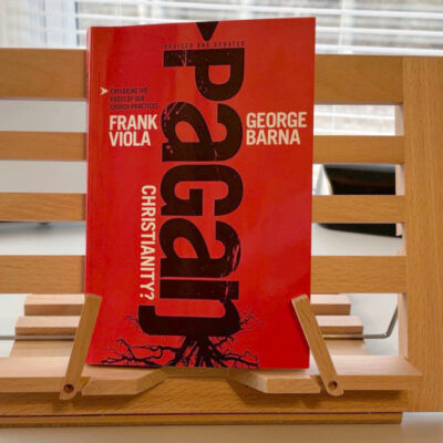 Book Pagan Christianity on a wooden book holder in a home
