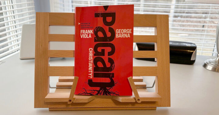 Book Pagan Christianity on a wooden book holder in a home