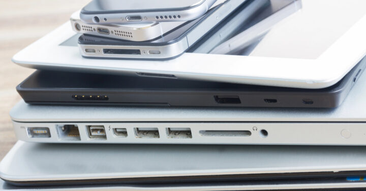 Pile of phones, tablets, and laptops