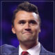 Head pictures of Charlie Kirk in coat and red tie
