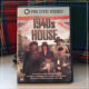 Copy of 1940s House DVD on couch with plaid pillows behind it