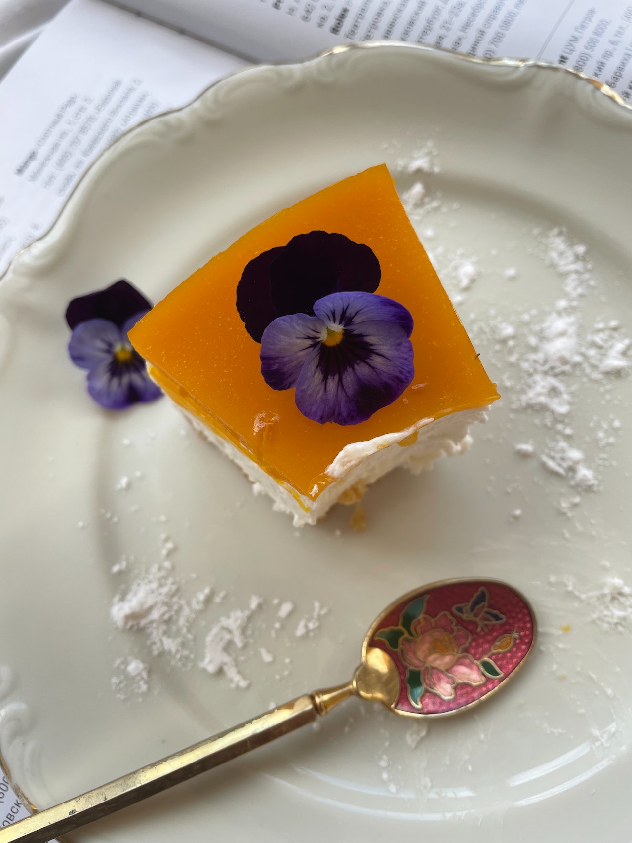 Dessert with purple pansy on top