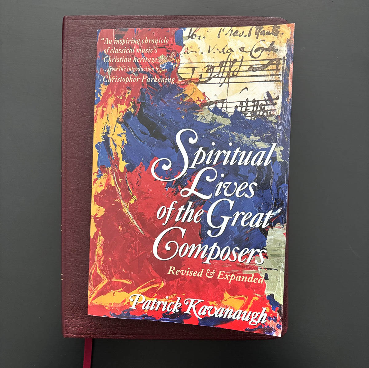 Spiritual Lives of the Great Composers book and Bible on table
