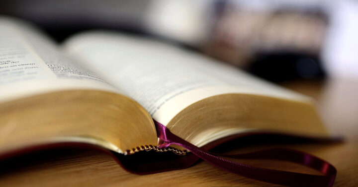 Open Bible on a wood table